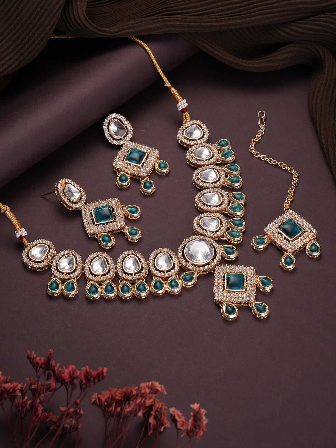 Jazz And Sizzle Gold Plated Green Kundan Studded & Beaded Jewellery Set with Maangtikka