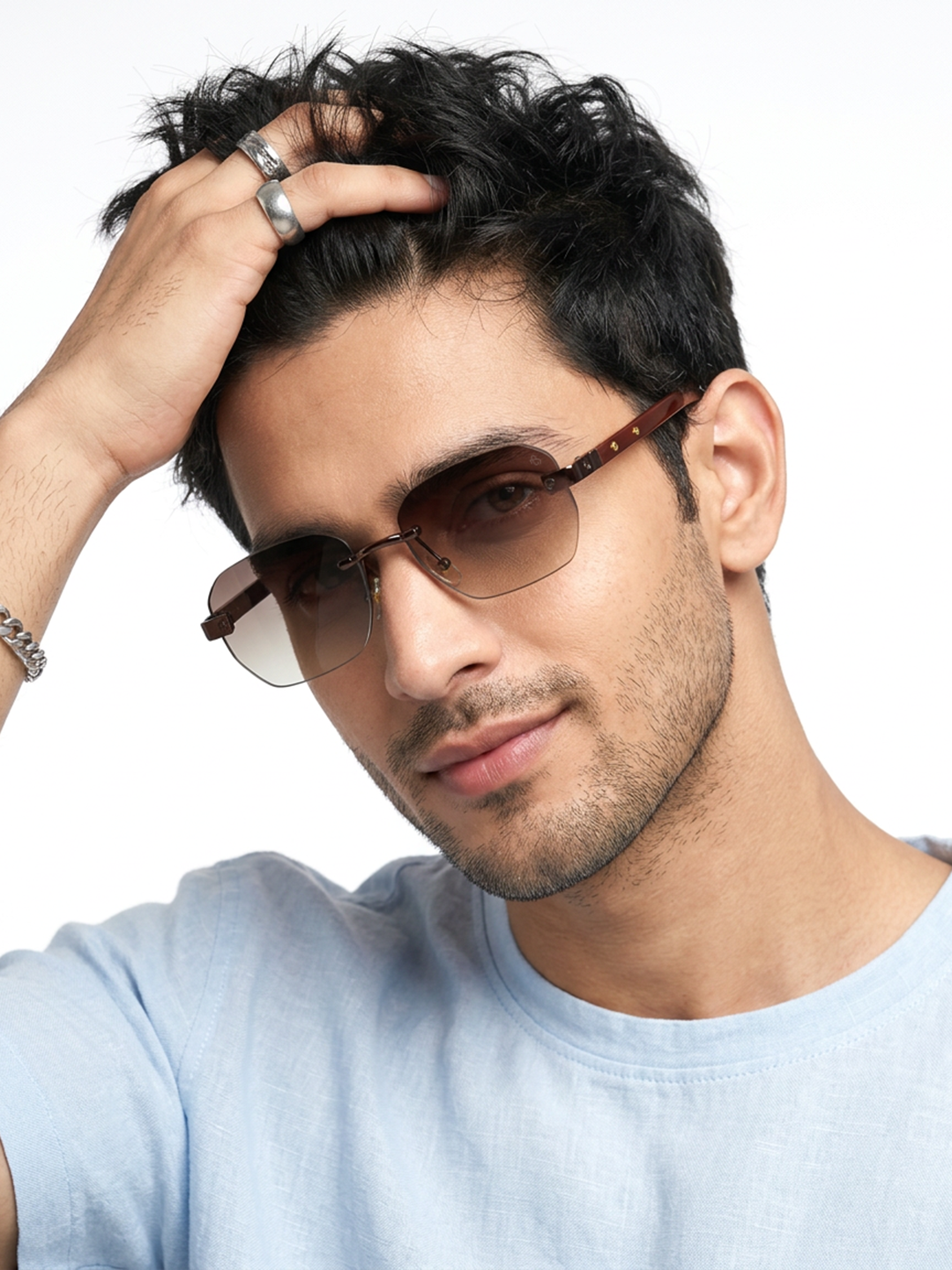 Essence Amber Brown Rimless Sunglasses for Men and Women - worn by a male model (image 1)