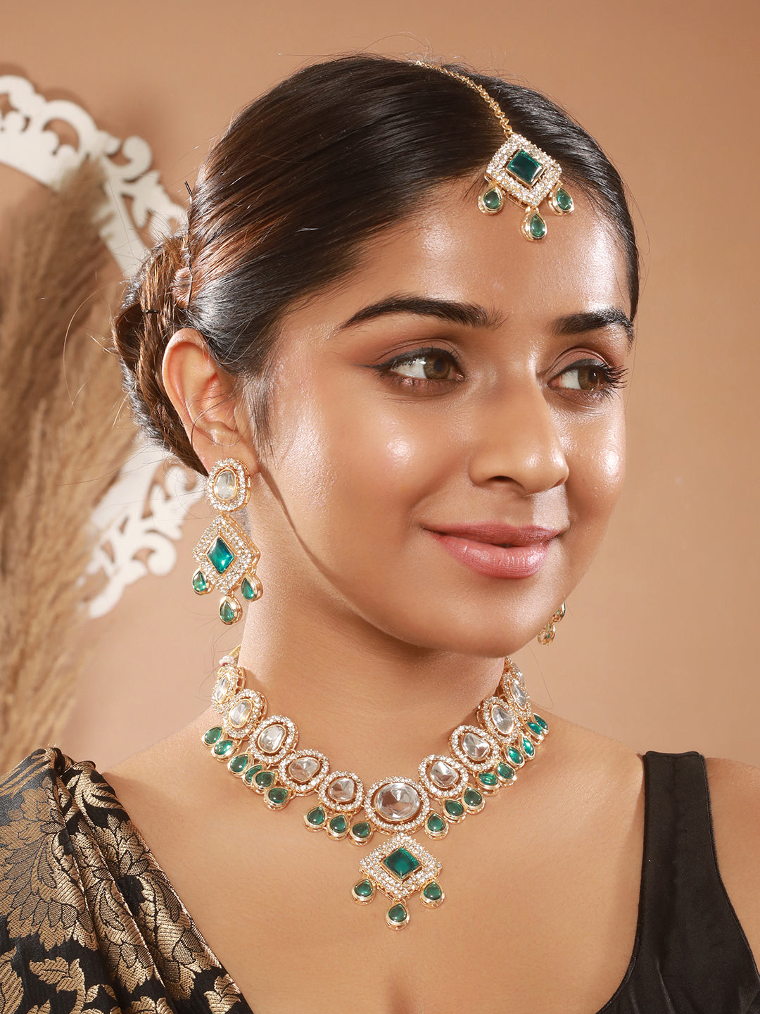 Jazz And Sizzle Gold Plated Green Kundan Studded & Beaded Jewellery Set with Maangtikka