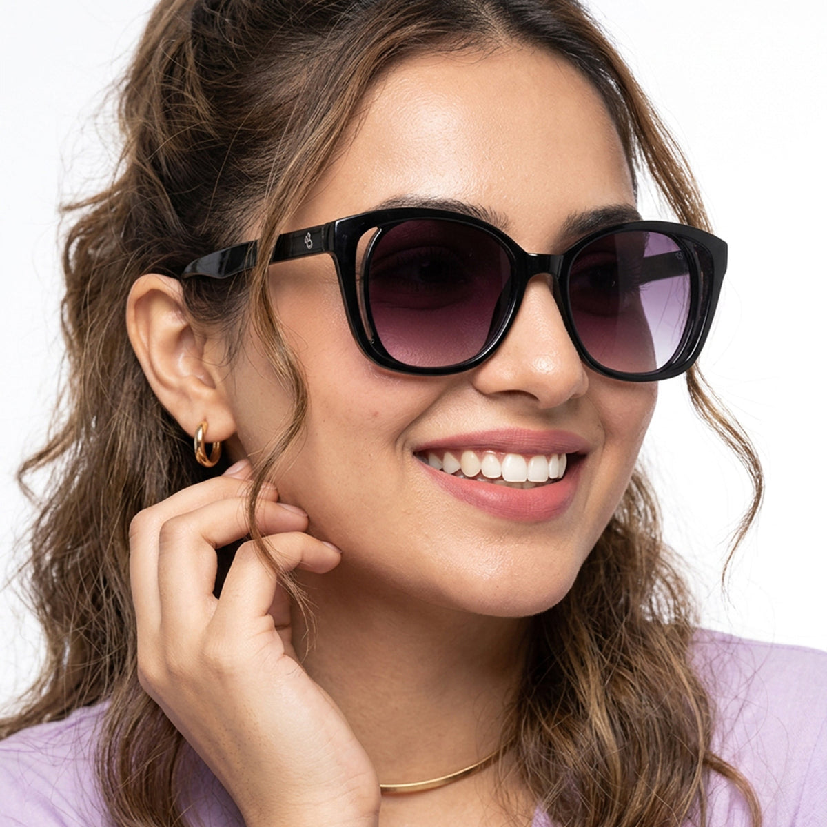 Eyejack Shine Black Round Sunglasses for Men and Women - Style 1218 - worn by a male model (image 1)