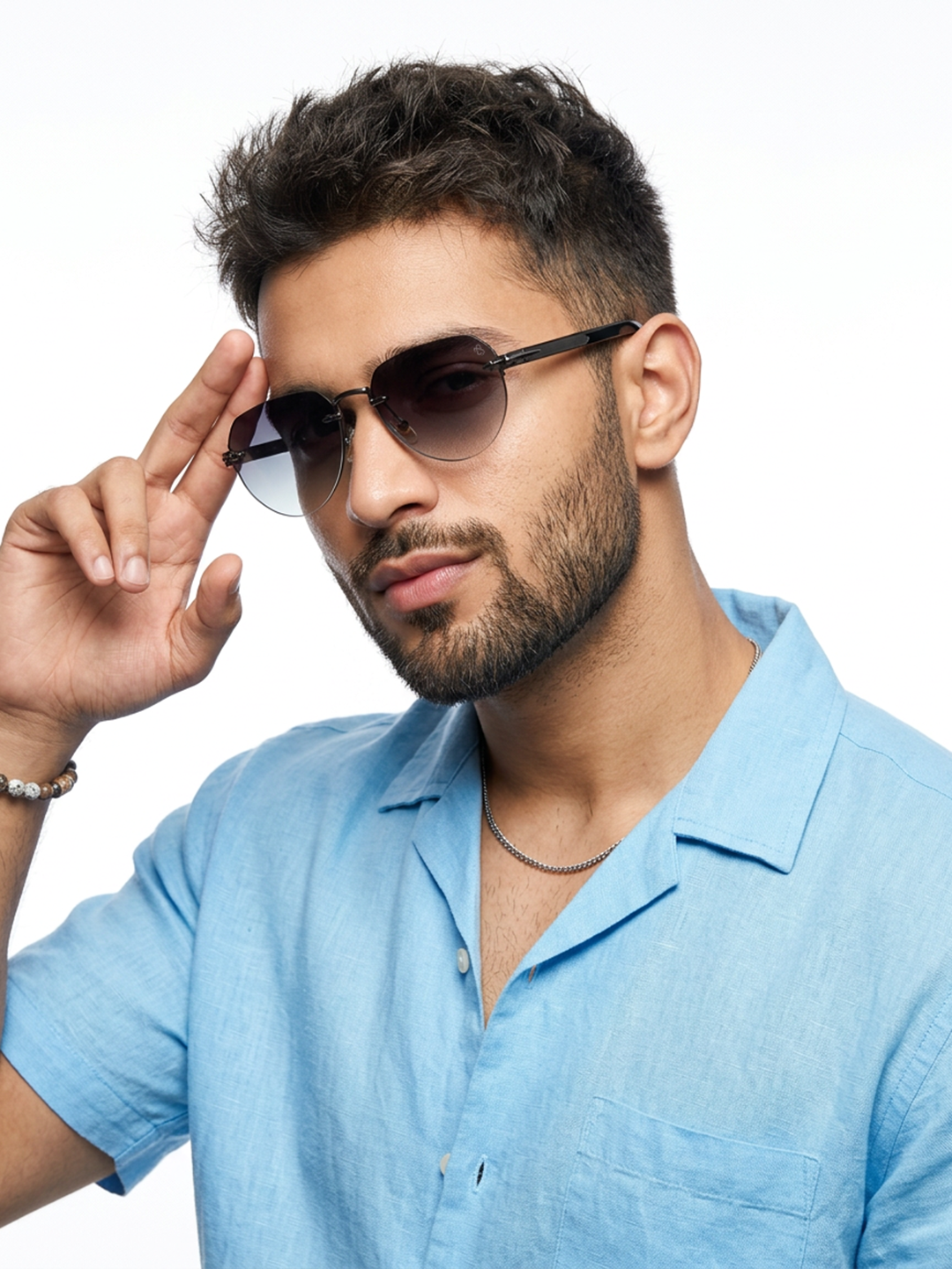 Essence Crown Grey Rimless Sunglasses for Men and Women - worn by a male model (image 1)