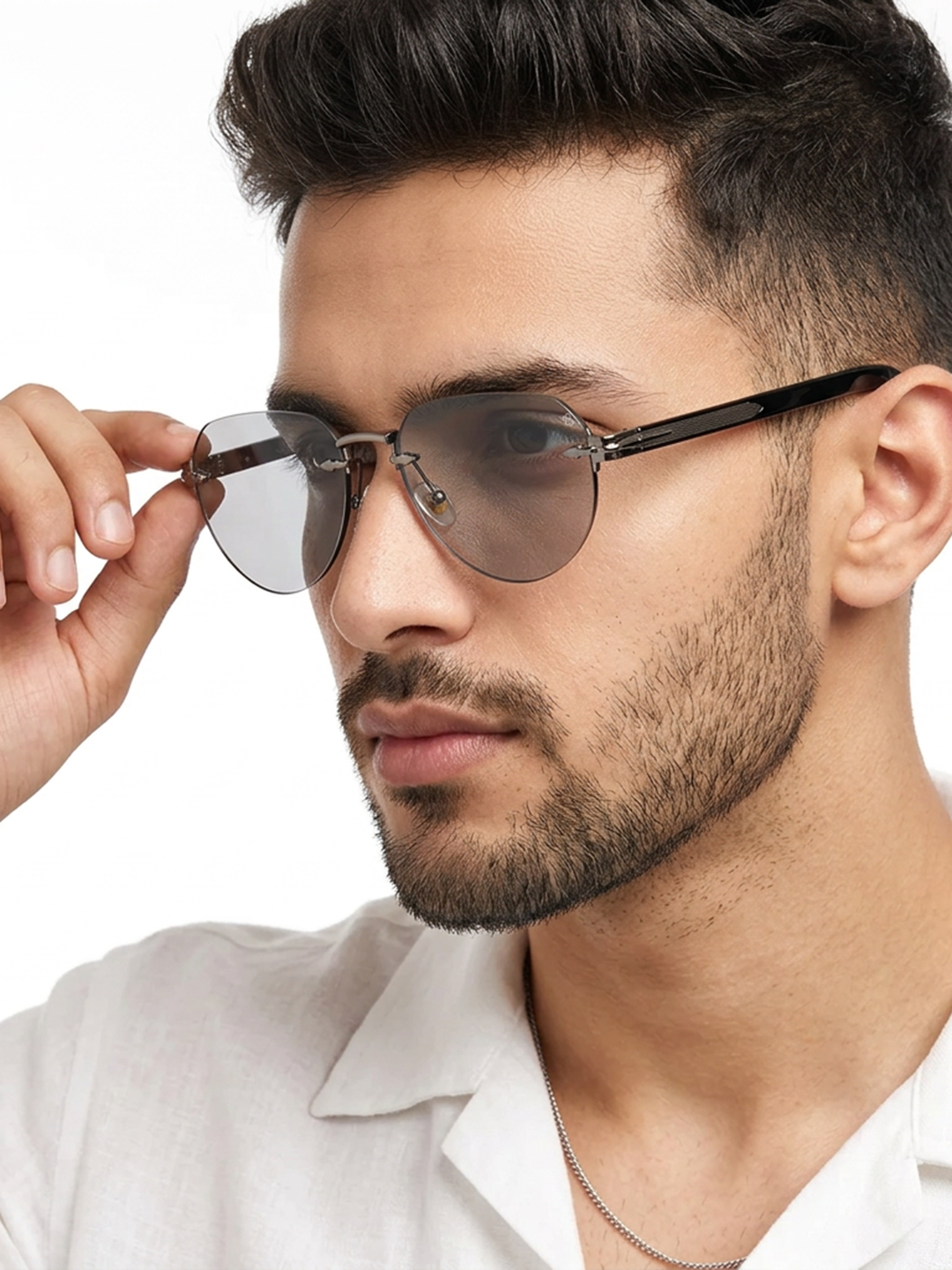 Essence Crown Silver Rimless Sunglasses for Men and Women - worn by a male model (image 1)