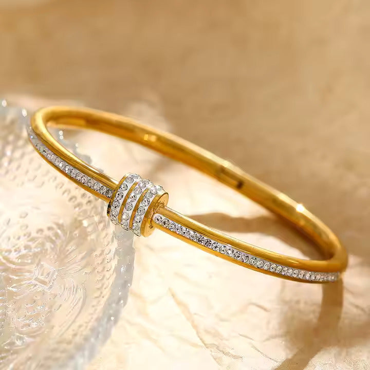 Jazz And Sizzle Gold Plated AD Studded Stainless Bangle Style Bracelet