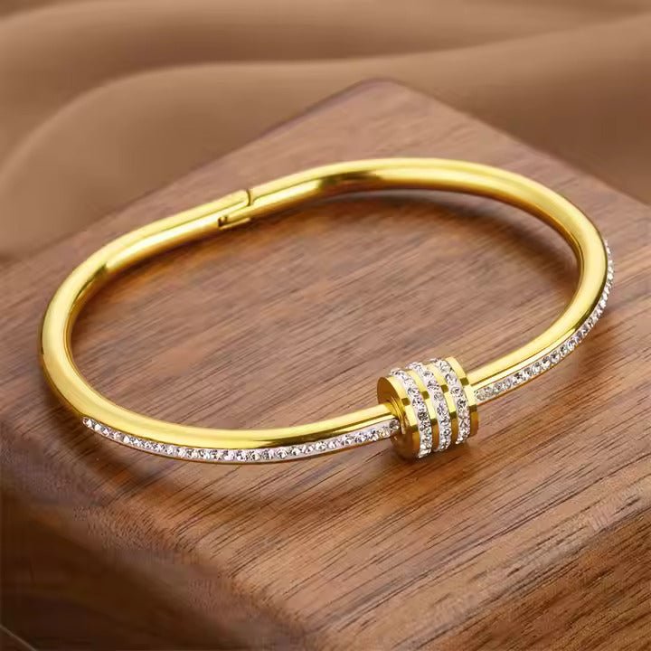 Jazz And Sizzle Gold Plated AD Studded Stainless Bangle Style Bracelet