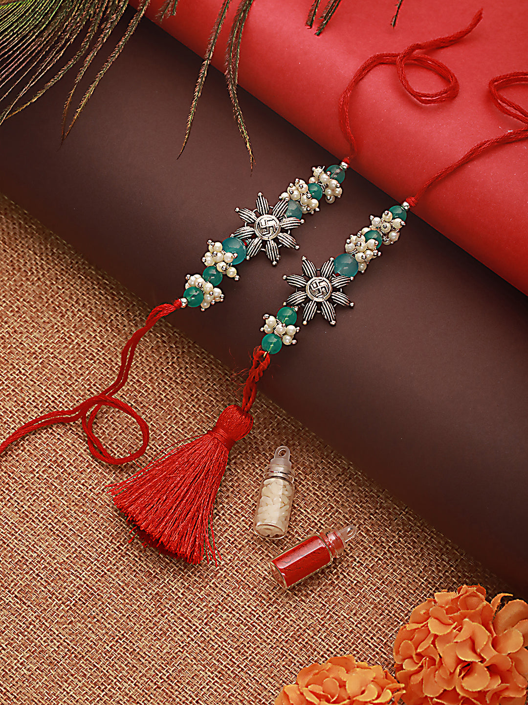 Jazz and Sizzle Set Of 2 Swastik Motif & Mogra Beaded Bhaiya Bhabhi Tasseled Rakhi