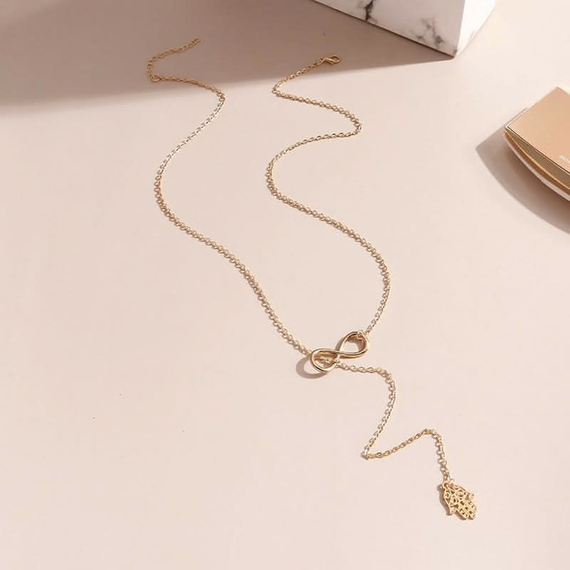 Faith & Protection: Infinity Cross & Hamza Gold Necklace Set of 3 pinapes