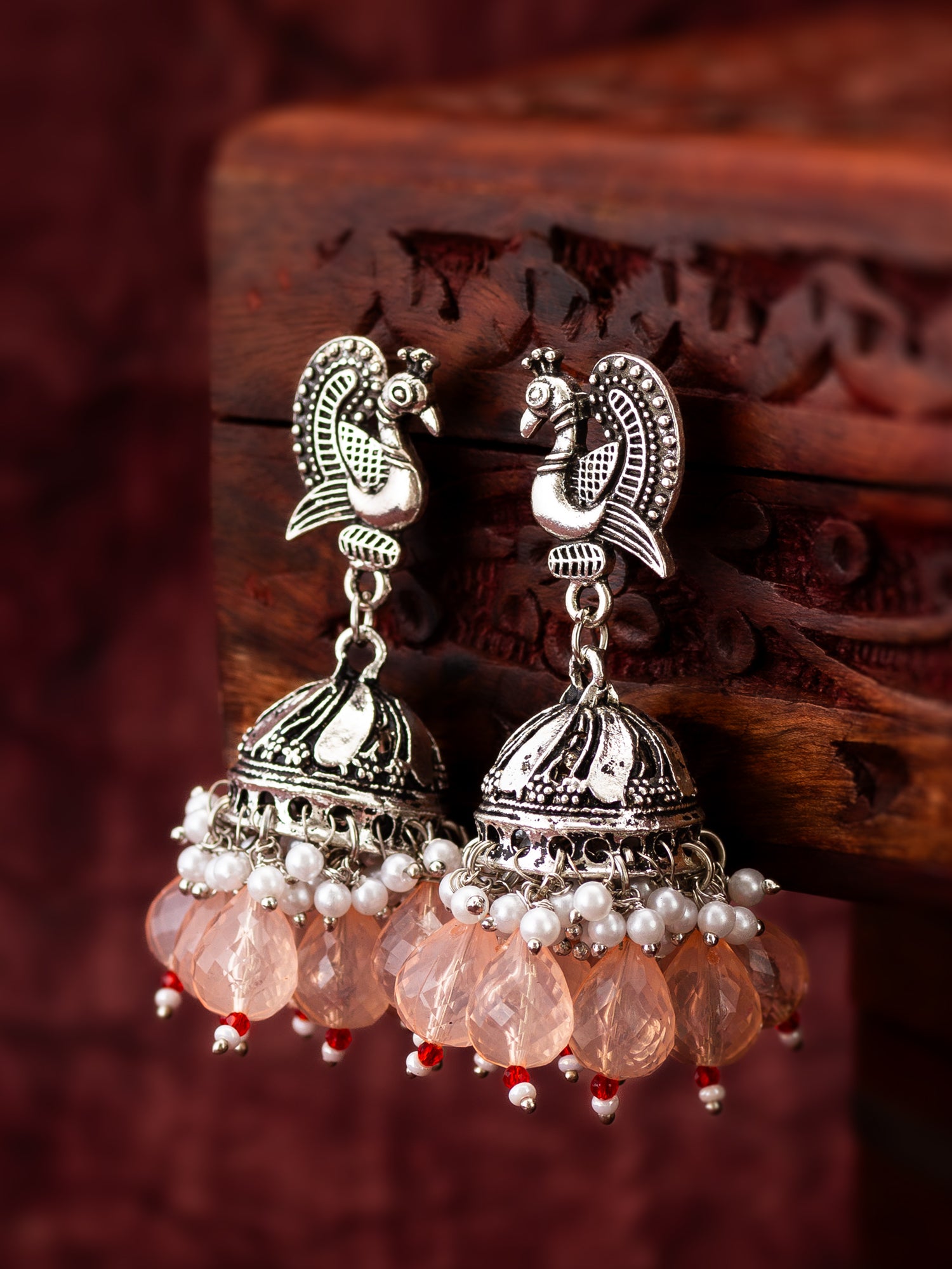 Oxidized Silver Peacock Jhumka Earrings with Peach Crystal Beads – View 4 | Aadita Jewelry
