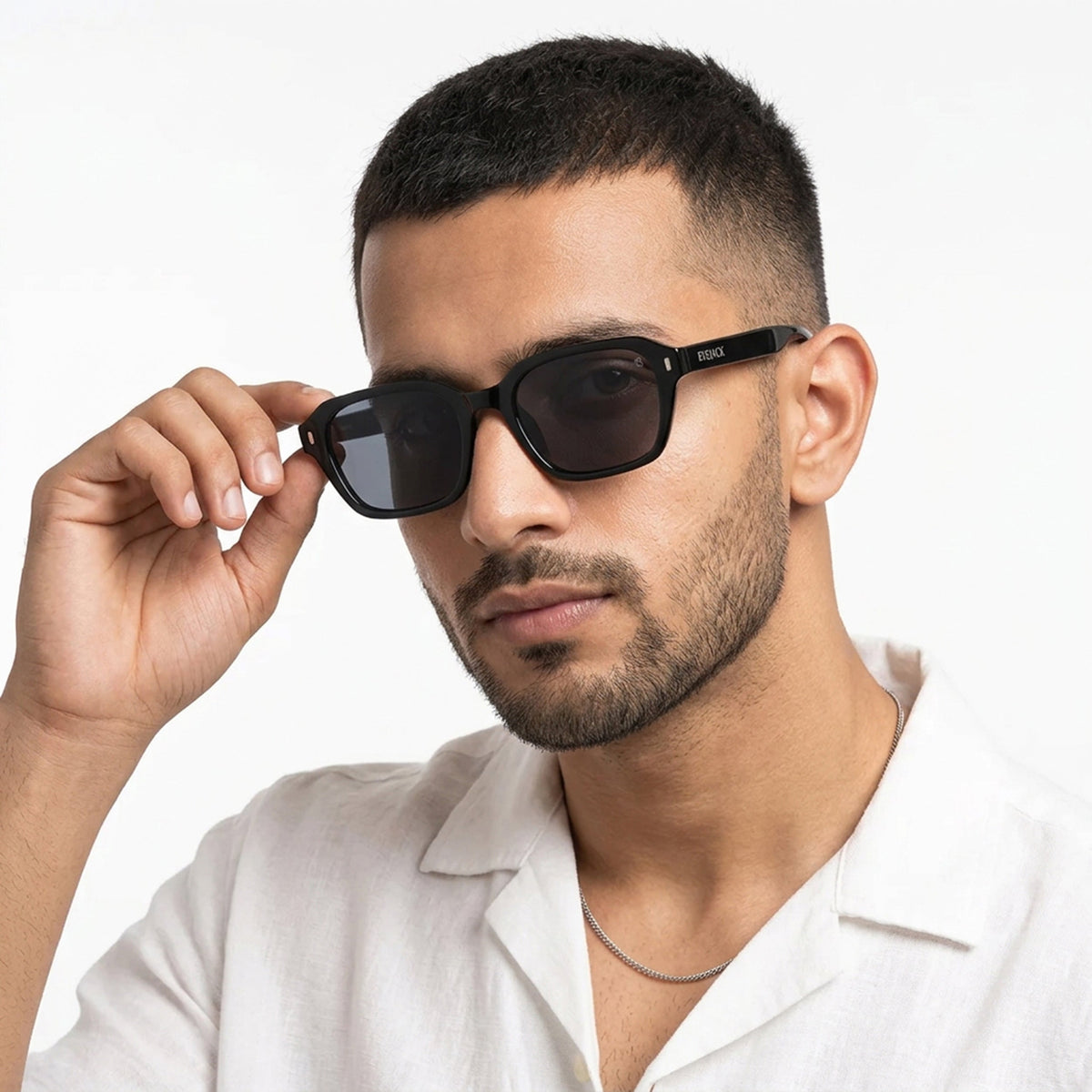Eyejack Black Square Sunglasses for Men and Women - Style L999 - worn by a male model (image 1)