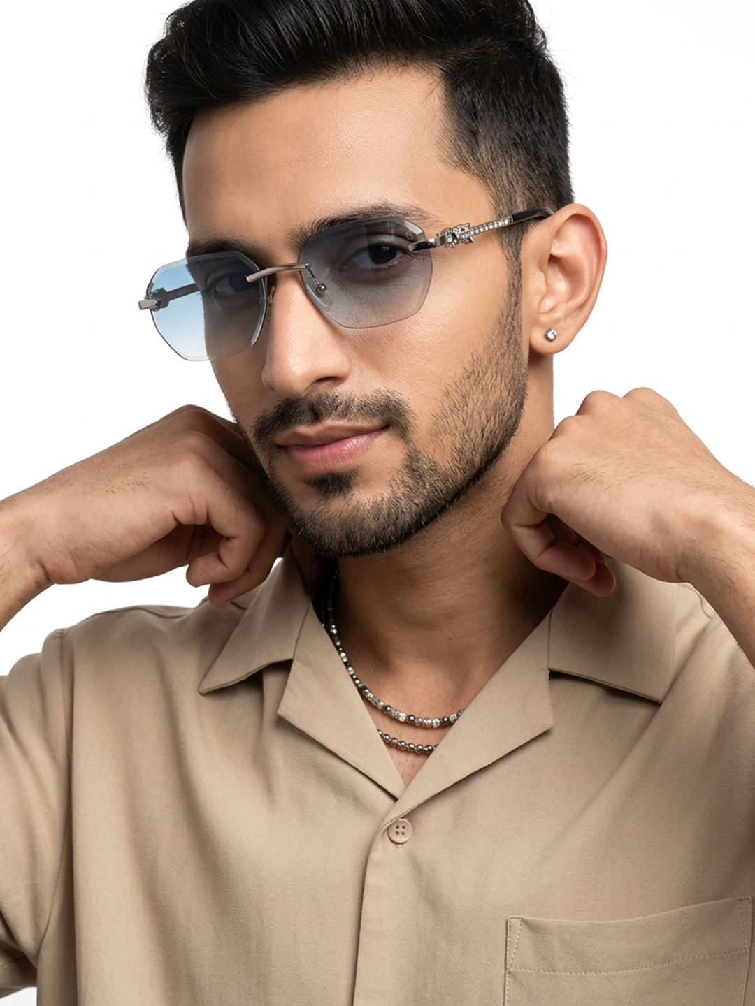 Essence Clarity Silver Rimless Sunglasses for Men and Women - worn by a male model (image 1)