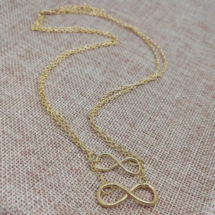 Faith & Protection: Infinity Cross & Hamza Gold Necklace Set of 3 pinapes