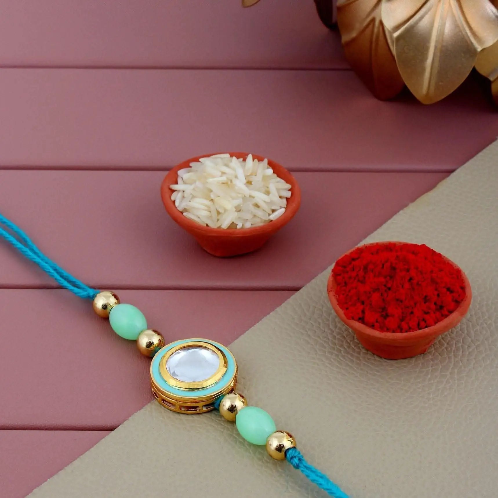 Designer Gold-Plated ferozi color meena thread rakhi with blue thread | LUCKY JEWELLERY - halfpeapp
