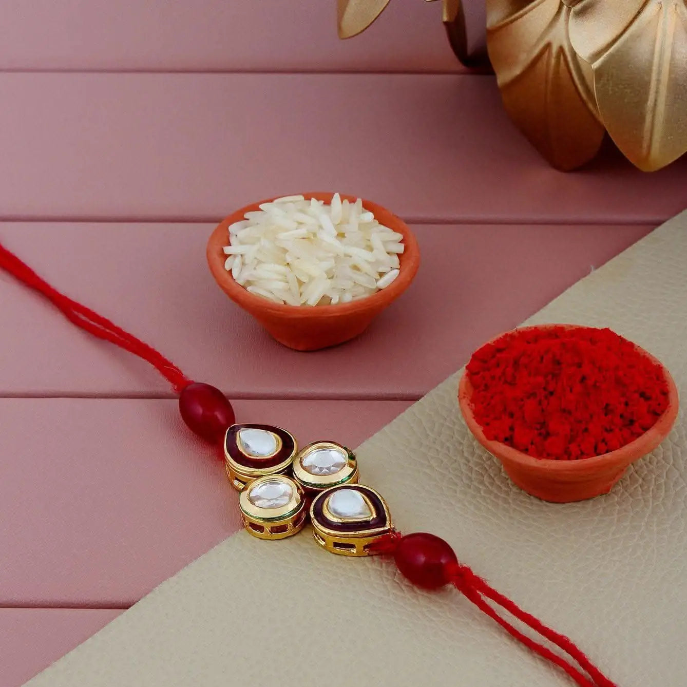 Designer Gold-Plated ferozi color meena thread rakhi with white stones and red beads | LUCKY JEWELLERY - halfpeapp