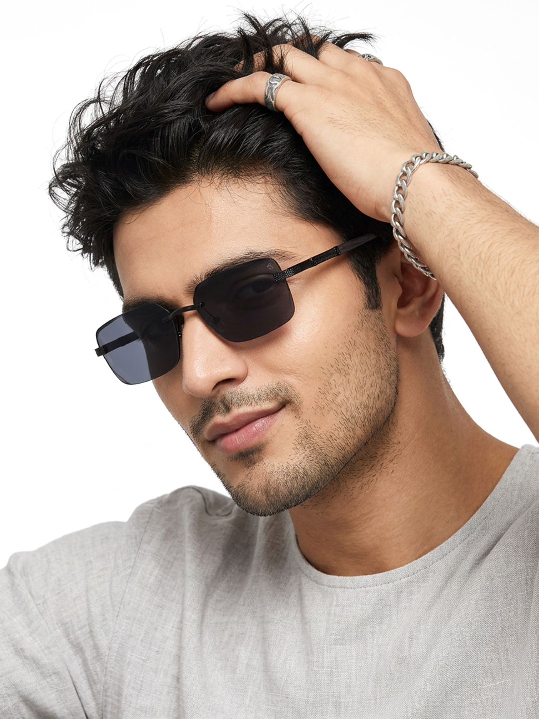 Essence Noble Black Rimless Sunglasses for Men and Women - worn by a male model (image 1)