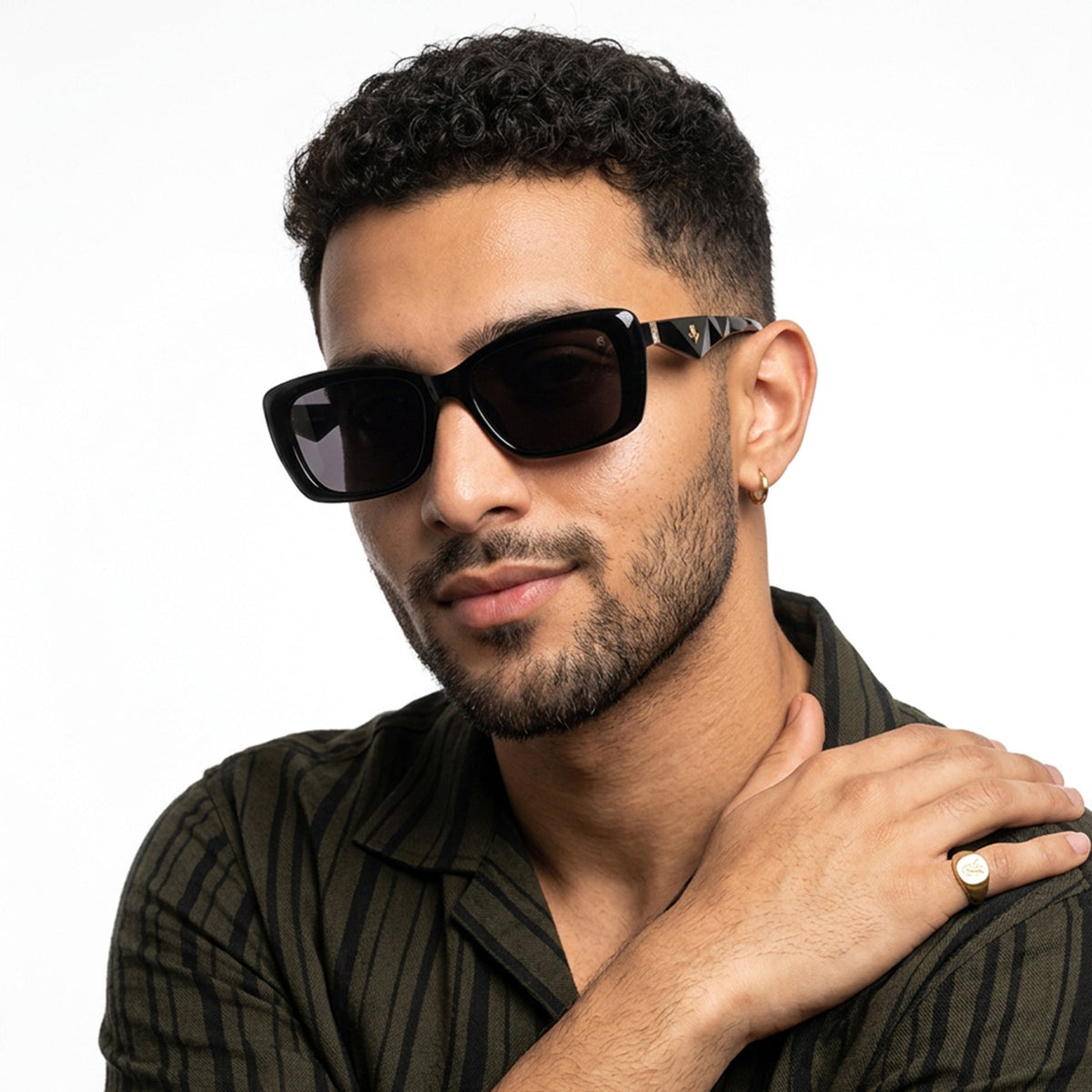 Eyejack Black Rectangle Sunglasses for Men and Women - worn by a male model (image 1)
