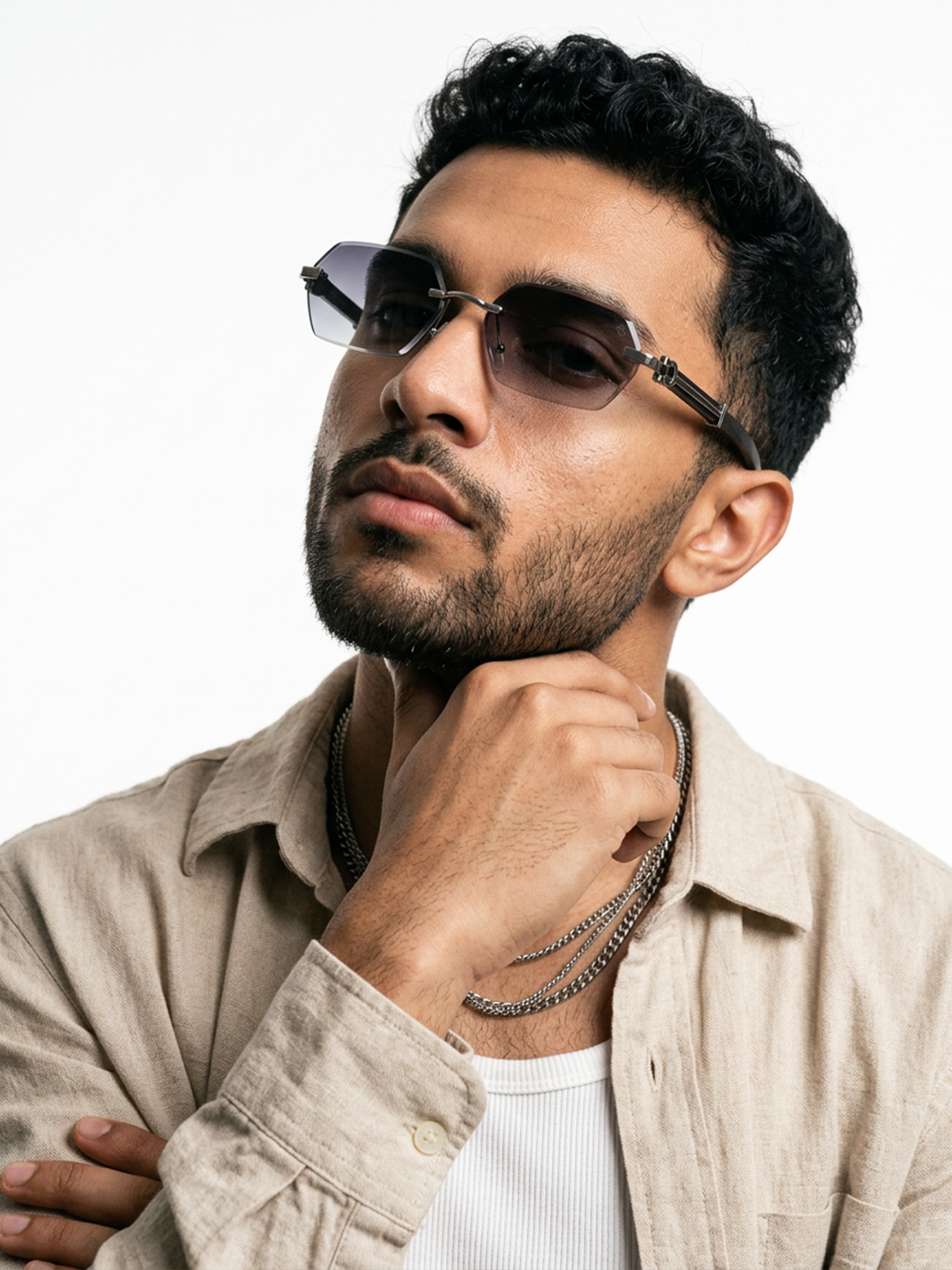 Essence Steel Silver Rimless Sunglasses for Men and Women - Style 2561 - worn by a male model (image 1)