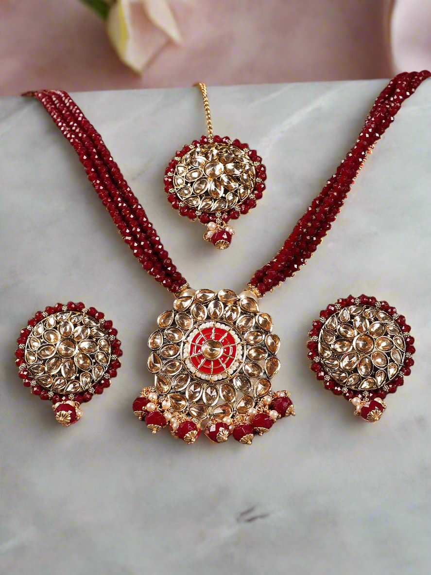 Gold-Plated & Kundan Studded Mahroon Beaded Multi-Strand Jewellery Set With Maangtika