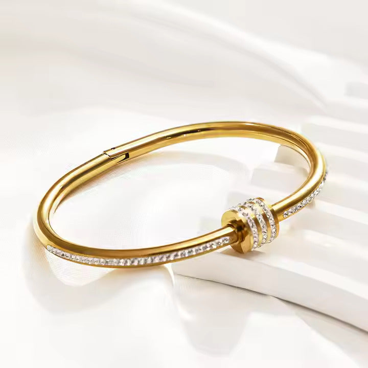 Jazz And Sizzle Gold Plated AD Studded Stainless Bangle Style Bracelet