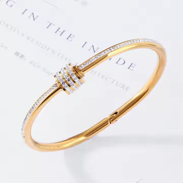 Jazz And Sizzle Gold Plated AD Studded Stainless Bangle Style Bracelet