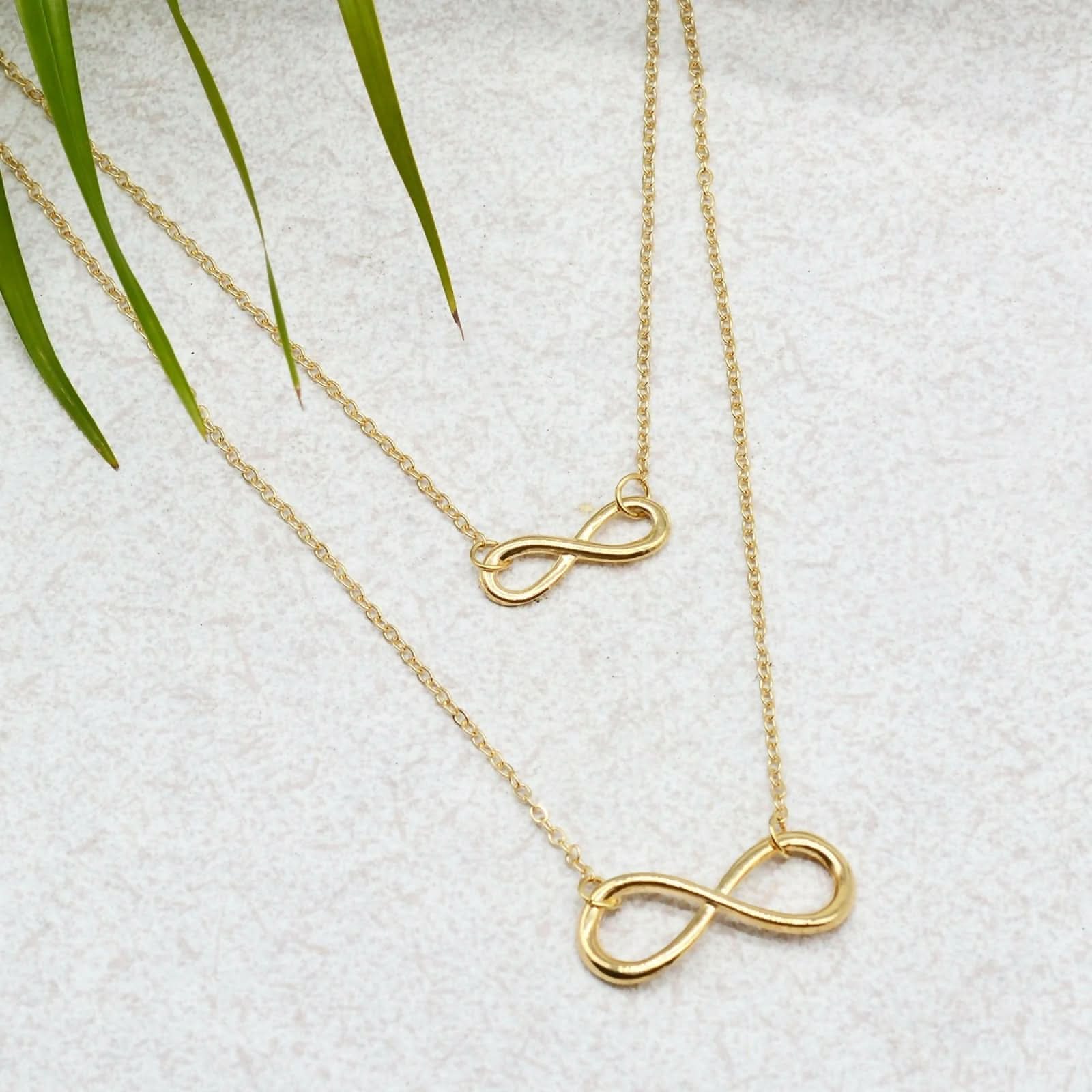 Faith & Protection: Infinity Cross & Hamza Gold Necklace Set of 3 pinapes