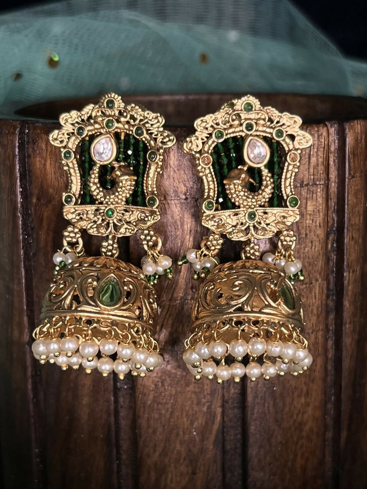 Rajwadi gold jhumka with red stones and white beads