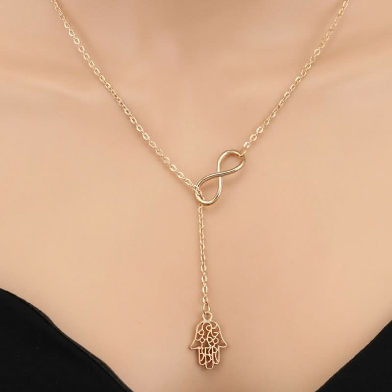 Faith & Protection: Infinity Cross & Hamza Gold Necklace Set of 3 pinapes