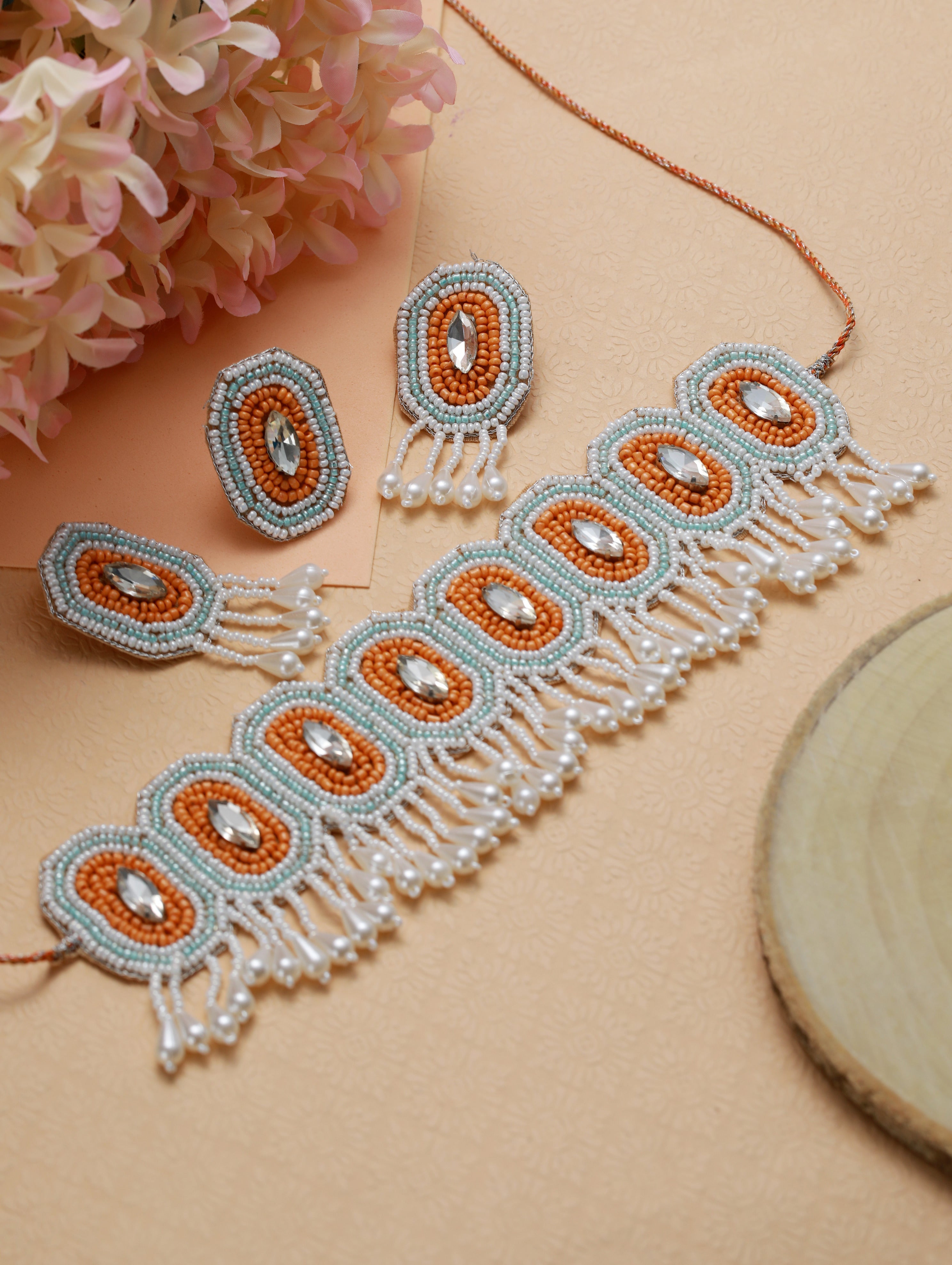 White Crystal Studded Gold-Plated Orange Beaded & Handcrafted Jewellery Set With Ring