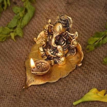 Leaf and Gold Plated Ganesha Idol with Diya - HalfPe