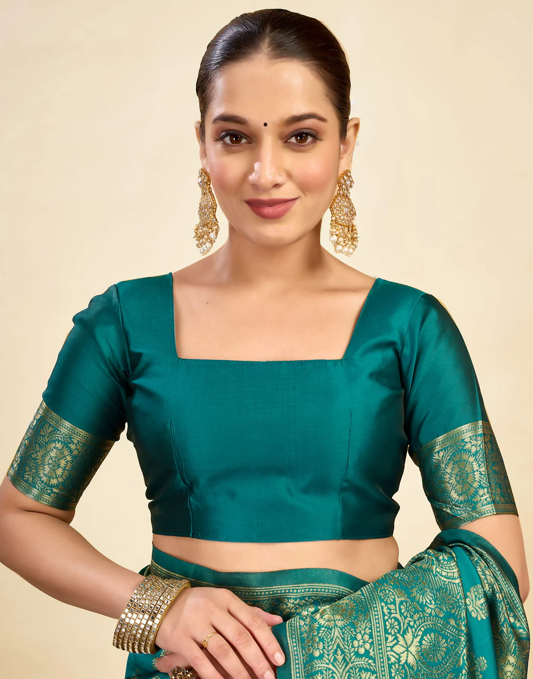 Royal Emerald Jacquard Saree with Golden Zari Work & Heavy Brocade Border