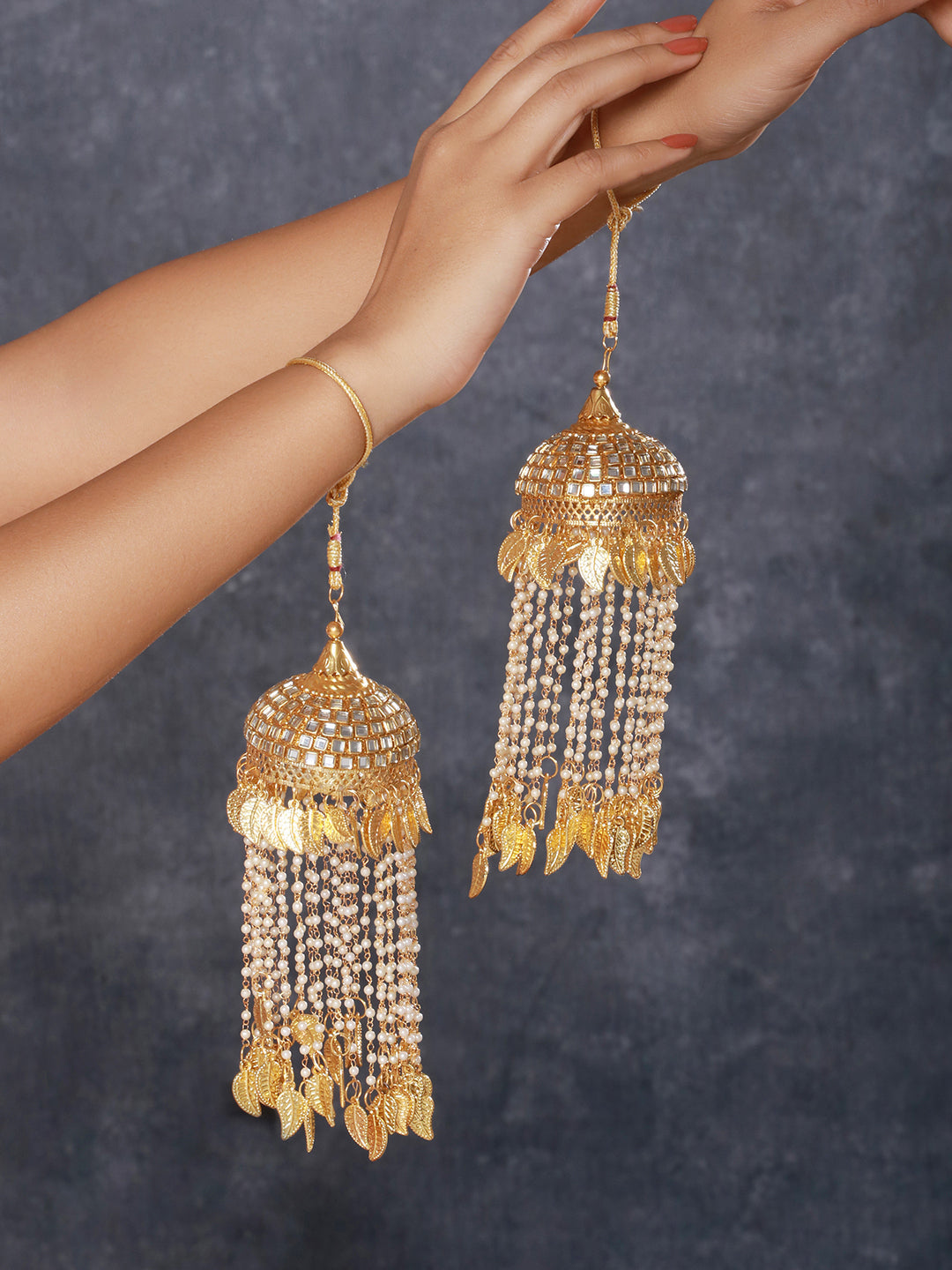 Set Of 2 Gold-Plated Stone Studded & Pearl Beaded Bridal Kaleera Secured With Drawstring Closure.