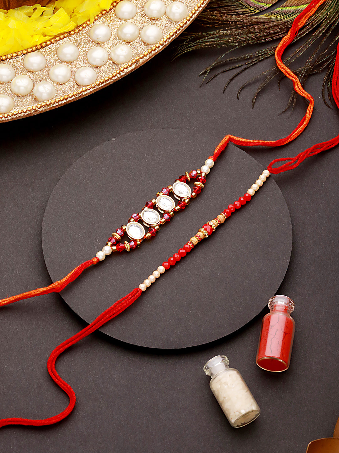Jazz And Sizzle Set Of 2 Kundan Maroon Pearl Beaded Thread Rakhi With Roli Chawal