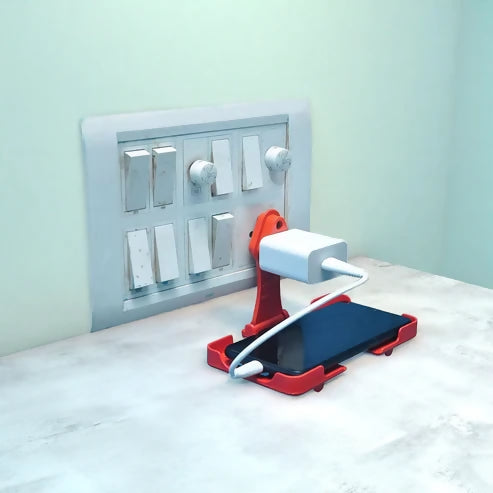 Multi-purpose Wall Holder Stand For Charging Mobile Just Fit In Socket And Hang (Red) ABHI Mobiles