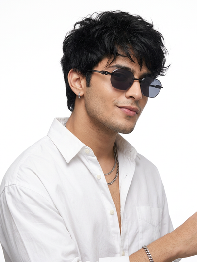 Essence Clarity Black Rimless Sunglasses for Men and Women - worn by a male model (image 1)