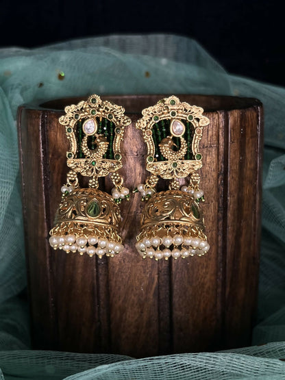 Rajwadi gold jhumka with red stones and white beads