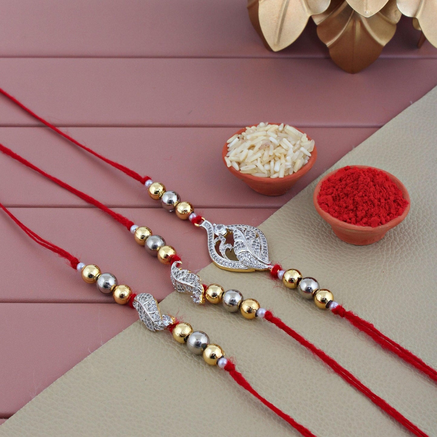 Designer Gold-Plated american diamond rakhi (pack of 3) | LUCKY JEWELLERY - halfpeapp