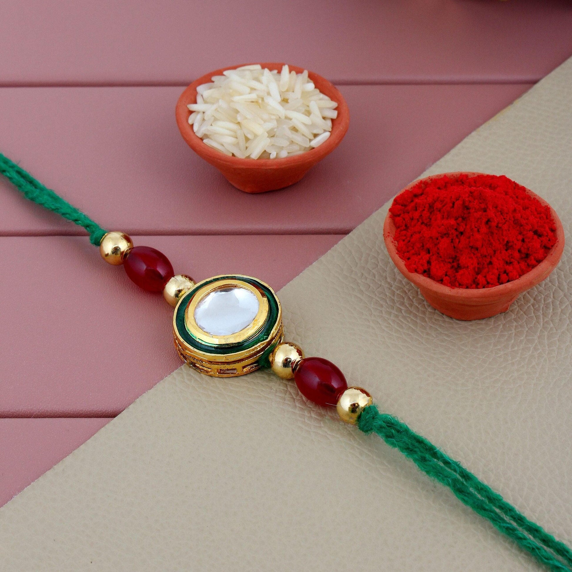 Designer Gold-Plated ferozi color meena thread rakhi with green thread and red beads | LUCKY JEWELLERY - halfpeapp