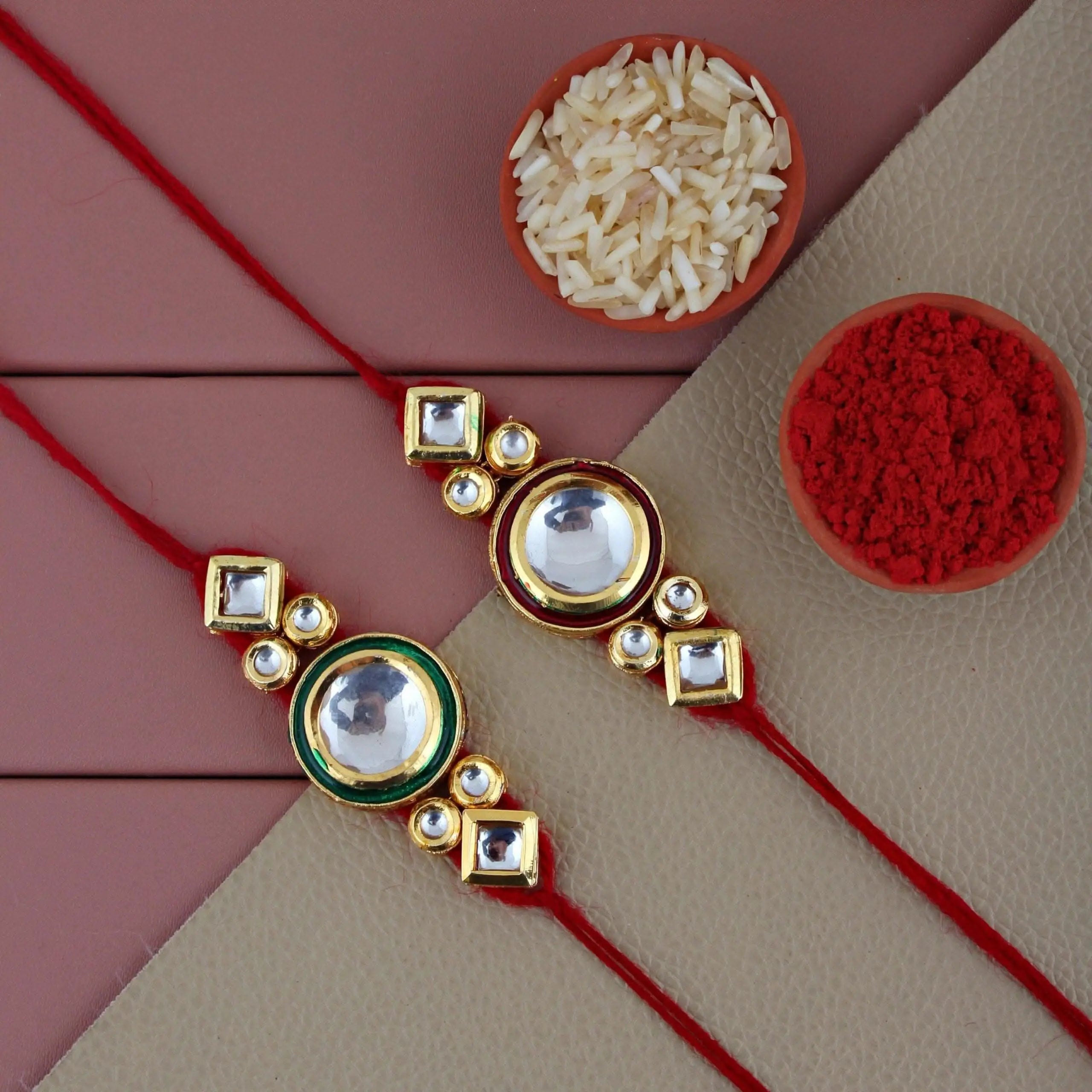 Designer Gold-Plated ferozi color meena thread rakhi with red and green coloured outer rings (pack of 2) | LUCKY JEWELLERY - halfpeapp