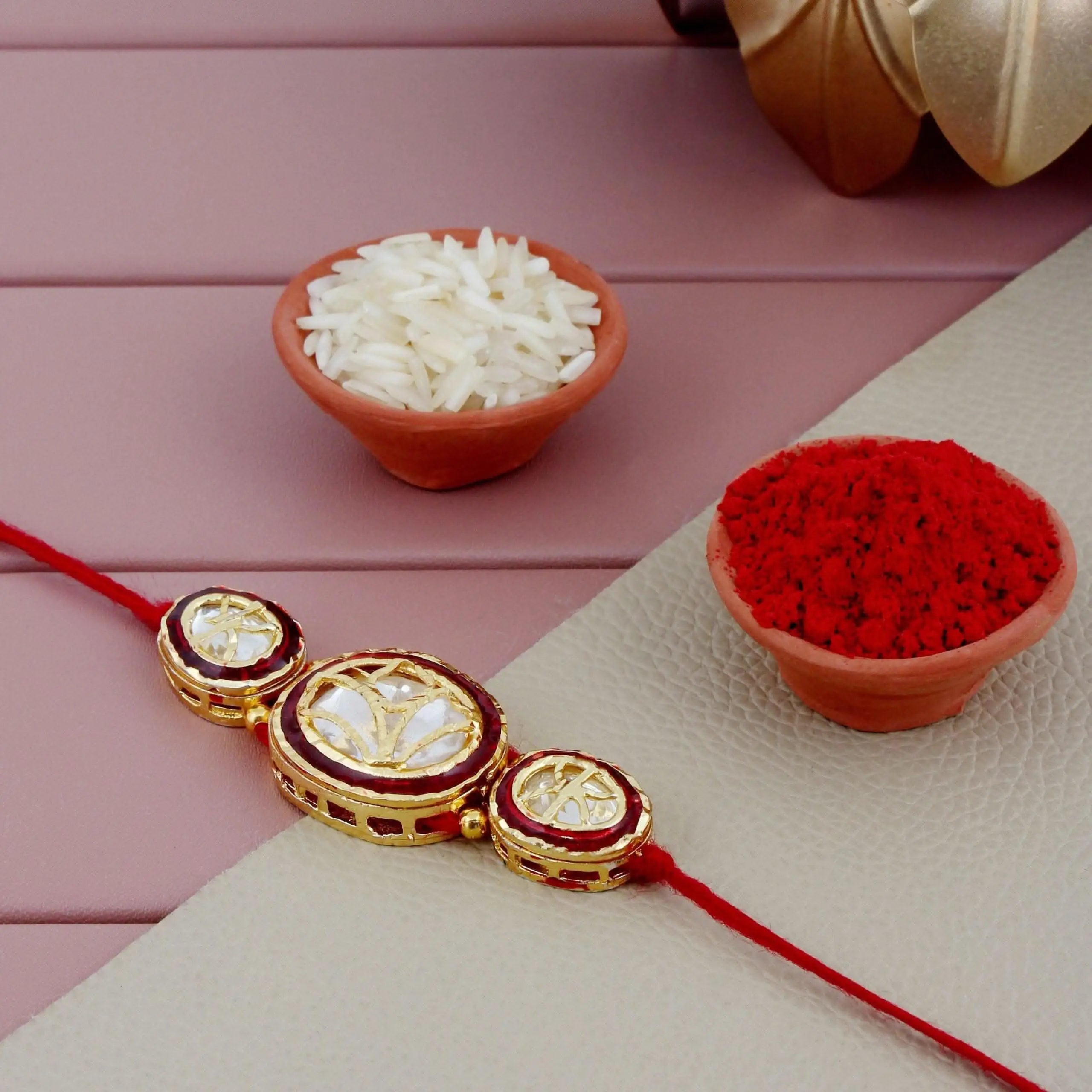 Designer Gold-Plated ferozi color meena thread rakhi with red outer oval shaped dollars | LUCKY JEWELLERY - halfpeapp
