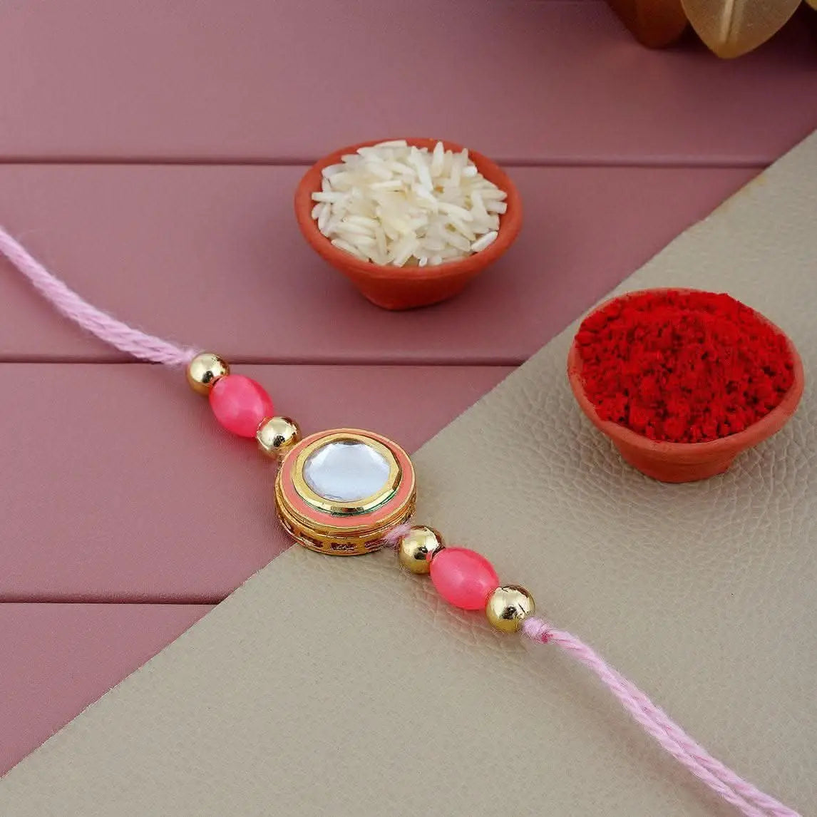 Designer Gold-Plated ferozi color meena thread rakhi with silver stone and orange outer ring | LUCKY JEWELLERY - halfpeapp